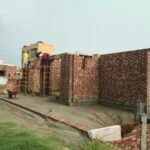 Grey structure brick masonry walls during house construction in Izmir Town Lahore