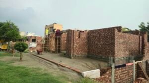 Grey structure brick masonry walls during house construction in Izmir Town Lahore