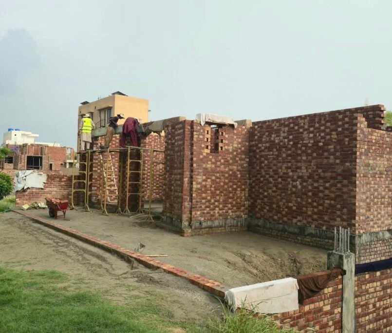 Grey structure brick masonry walls during house construction in Izmir Town Lahore