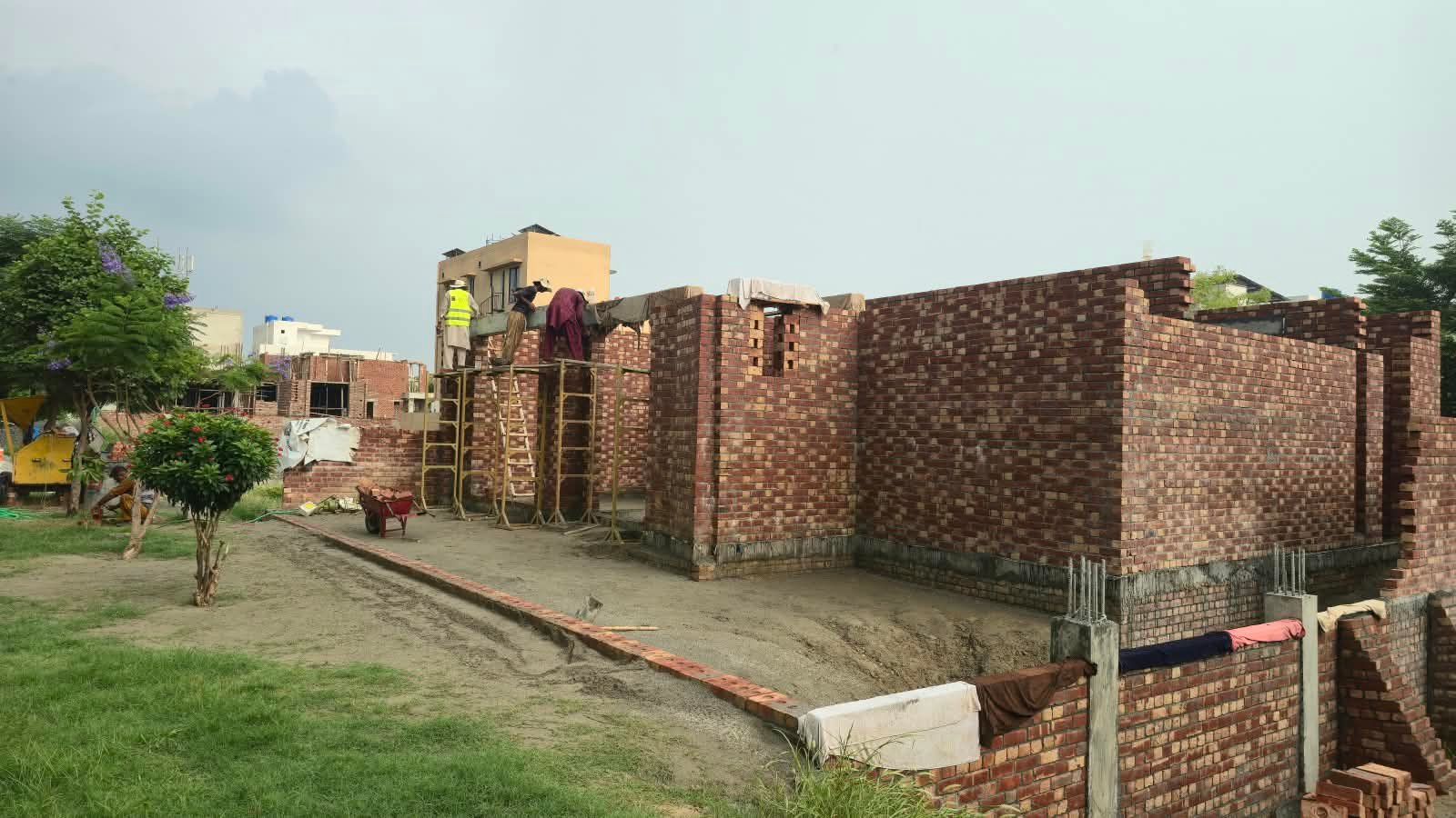 Grey structure brick masonry walls during house construction in Izmir Town Lahore