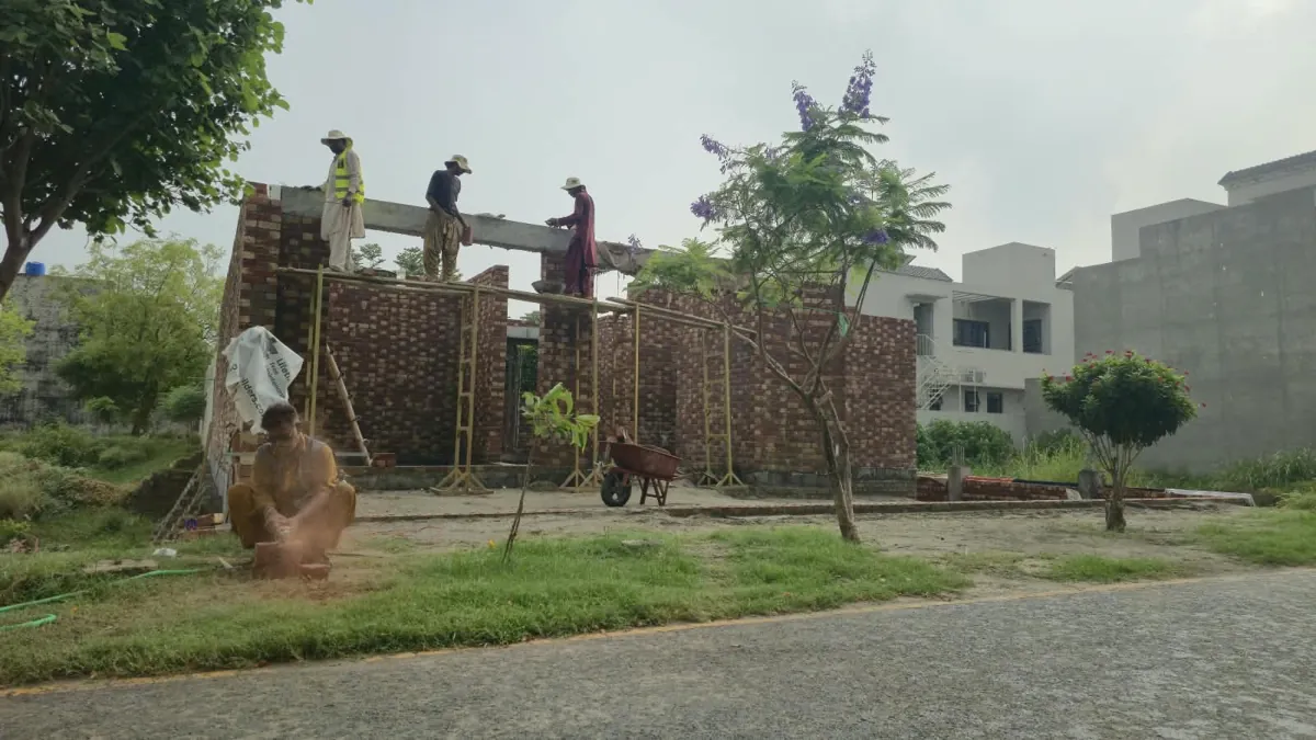 10 Marla house construction in Bahria Town Lahore: brick walls and site view