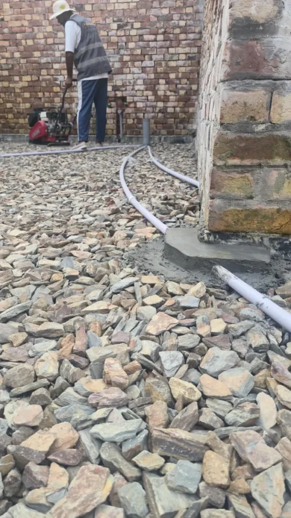 Stone soling with conduit pipes at a 10 Marla house in Lake City Lahore